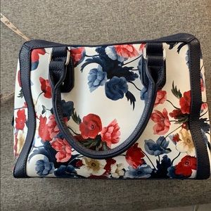 Red and blue floral handbag